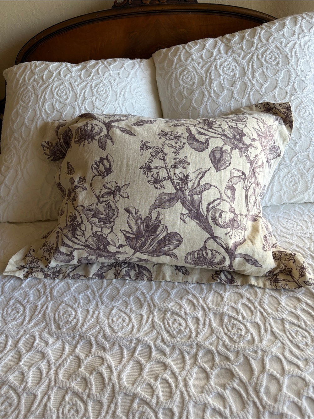 Pottery Barn Floral Pillow Sham in Cream and purple. Approximately 24”x21”.